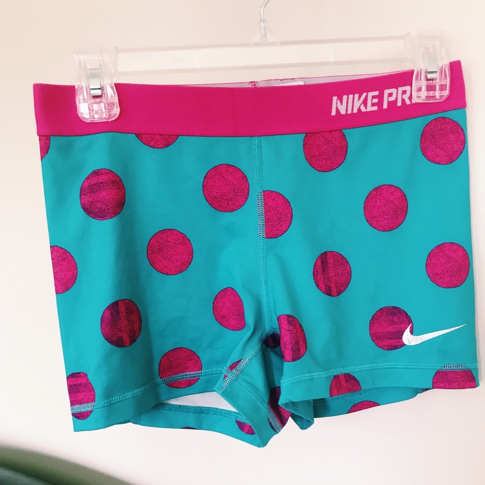 Teal and pink Nike pro compression shorts
